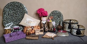 lot 340 image: Mixed Lot of Leopard Print dcor Serving trays, Jewelry Boxes, Decorative Statue and More