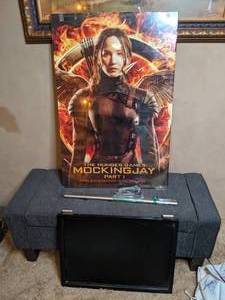 lot 344 image: The Hunger Games MOCKINGJAY Part 1 Framed Poster & Crate & Barrel Small Black Dry Erase Board