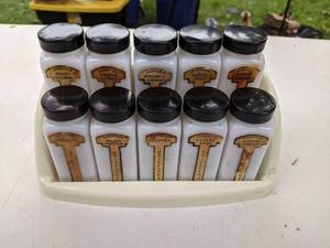 lot 243 image: Vintage 10 pc 1950s Milk Glass Spice Jars & Spice Rack with Black Lids