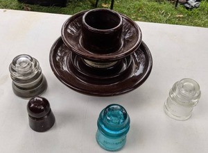 lot 149 image: Antique Telephone Insulators Blue Glass, Clear Glass, & More