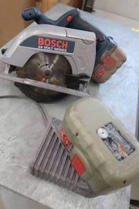 lot 114 image: HAND SAW WITH CHARGER IN BAG  2 EXTRA TOOL BAGS