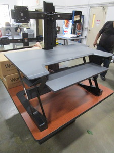 lot 141 image: ERGOTRON SIT-STAND DESK TOP UNIT FOR DUAL MONITORS