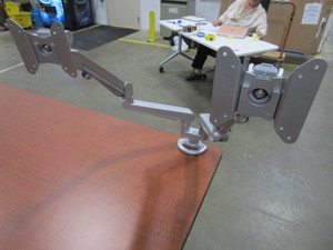 lot 147 image: TWO CLAMP ON FULLY ADJUSTABLE DUAL MONITOR ARMS