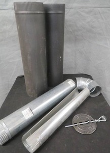 lot 12 image: NEW DUCT WORK AND CAST IRON DAMPER.