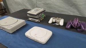 lot 30 image: PLAYSTATION AND PLAYSTATION ONE WITH GAMES AND CONTROLLERS