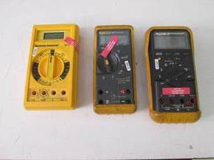 3 multimeters marked out of calibra...