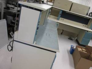 Large cubicle style L shaped desk Approx 11 feet one way and 9 feet the other way. Lots of electric outlets. Bring tools to disassemble