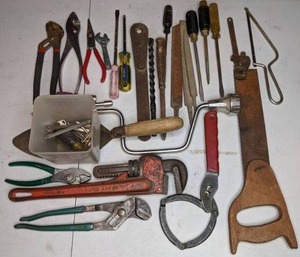 lot 69 image: Mixed Lot of Tools Pliers, Hand Saw, Wrenches, Screwdrivers, Metal Files, Vintage Hand Crank drill, & More