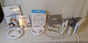 lot 327 image: Wii Console with Mario cart game and steering wheels