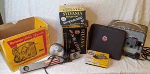 lot 330 image: Vintage Kodak Brownie Projector, Sylvania Photolamp & Movie Lights, and Splicer (in original boxes)