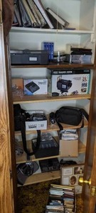 lot 333 image: Electronics lot Canon Powershot Camera, Video Transfer System, Handheld Sony and Canon Video Cameras, Radios, 8mm Rewinder, VHS tapes, CDs, Picture frames and more electronics