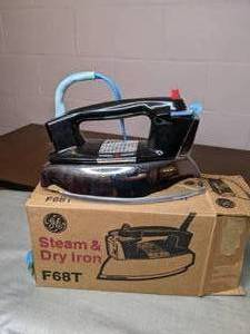 lot 513 image: Full size folding ironing board & two GE irons