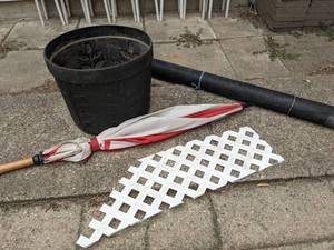 lot 198 image: Lot of Planter, Umbrella, Roll of Window Screen & a Bit of Trellis