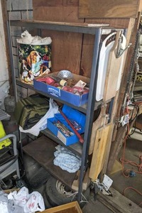 lot 89 image: Metal Shelf, Fishing Supplies, Cutting Boards, Tires