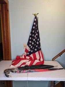 lot 212 image: American Flag, Flagpole w Eagle Topper and 2 Umbrellas