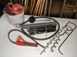 lot 134 image: Tie Down Straps, Tie-Out Stake, and Other Items