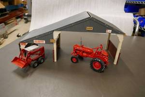 lot 10 image: IH Model A tractor, Gehl skid loader with barn