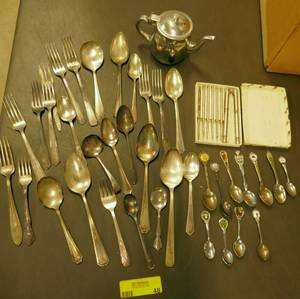 lot 48 image: Group of vintage silverware, creamer, nut cracker and picks, and collector spoons