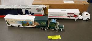 lot 95 image: 2 semi trucks and trailer - toy -  Peterbilt Farm Journal and Evers Toy Store