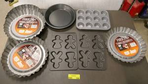 lot 109 image: Baking pans, 2 gingerbread cookie pans, mini muffins, pie, and 4 Duncan Hines Bakers secret dessert pans