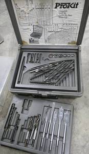 lot 147 image: Box of staples, wireless indooroutdoor outlet remote controls, drill bit kit, plano storage box