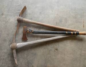 lot 176 image: pair of pick axes and a wood splitting axe