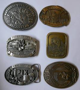 lot 205 image: 6 Belt Buckles, 5 are limited edition, Pewter, 1 Brass - Farm, Wheat, Rodeo, Fish