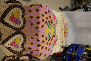 lot 209 image: 2 vintage chenile bedspreads.  The peacock one with hearts measures approx 85x104.  the only flaw I found was a small tear by the one flower.  The pink one says it is for a double bed and is good with the exception of one small hole at the edge