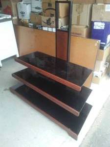 lot 58 image: 3 Tiered Entertainment Center. Dark Smoked Glass