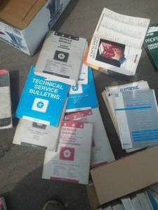 lot 102 image: 1980s Decade Chrysler Manuals and more.