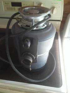 lot 139 image: Garbage Disposal  used but working - Insinkerator Brand.