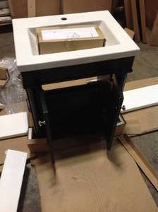 lot 1 image: 24 Vanity in. Bath Vanity in Espresso with Ceramic Top in White with White Basin by Unbranded Customer Returns See Pictures