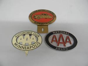 lot 20 image: VINTAGE TRIPLE AAA AUTOMOBILE CLUB MINNEAPOLIS LICENSE PLATE TOPPER - NATIONAL AWARD AAA BADGE - STATE FARM MUTUAL AUTO INS. CO. - NICE PIECES - SEE PICTURES