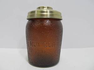 lot 69 image: Vintage Embossed Amber Glass DUN-RITE Cigar Humidor Jar