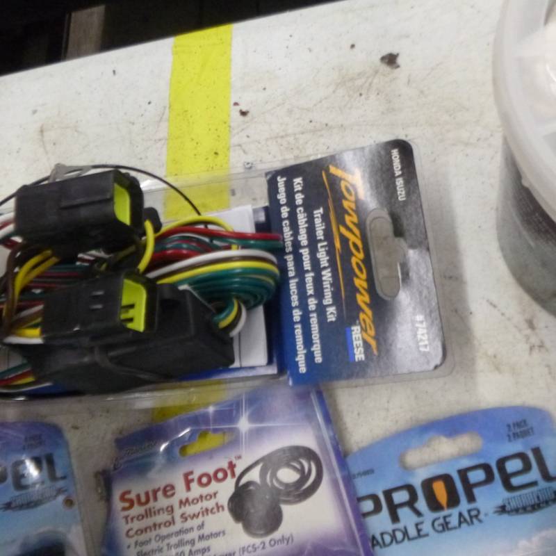 lot 223 image: Anchor and Boat Accessories (in original packaging)  with Paddle Gear, Trolling Motor Switch, Trailer Wiring Kit, Adjustable Clamp On Rod Holder, Scupper Stoppers, and more