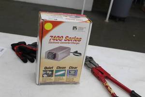 lot 86 image: Parallax Power Supply 7400 Series Electronic ConverterCharger (in original box)