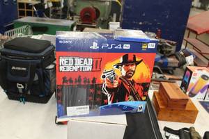 lot 24 image: Sony Red Head Redemption II PS4 Pro Game Console 1TB 4K (in original box)  with PS4 Call Of Duty Black Ops Game