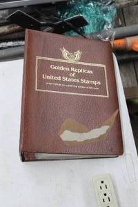 lot 37 image: Golden Replicas of United States Stamps Proof Replicas 22kt Gold with Stamped Letters in a Collection Book