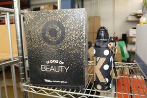 lot 56 image: 12 Days of Beauty Makeup, Justice Water Bottle