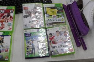 lot 128 image: Lot of (4) Xbox 360 Video Games  - NHL11, FIFA soccer 11, Masters Tiger Woods, Kinect Sports Season Two