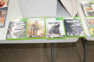 lot 125 image: Lot of (4) Xbox 360 Call of Duty Video Games  -  Advanced Warfare, Modern Warfare II, Ghosts, Black Ops