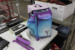lot 111 image: Riedell Womens Skates Size 8  with Zuca Rolling Case