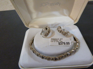lot 104 image: J.C. Penney Sterling and Diamond Bracelet and Earrings