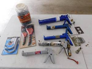 Five Caulking Guns--Premier 9 Ratchit Caulk Gun--Two Crawford Handy Rack--Strap Wrench Set--Container Of Nails, Etc.
