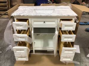 South Bay 43 in. Single Bath Vanity in White with Marble Vanity Top in Carrara White with White Basin (good condition) review pictures