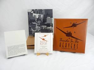 lot 13 image: Set of 2 Vintage Limited Edition Thunder in the Heavens - Classic American Aircraft of World War II Leather Bound Books