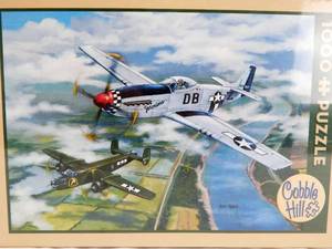 lot 48 image: Cobble Hill Ken Zylla Escort To Oshkosh 1000 Piece Sealed Puzzle
