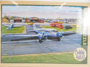lot 49 image: Cobble Hill Ken Zylla Municipal Airport 1000 Piece Sealed Puzzle