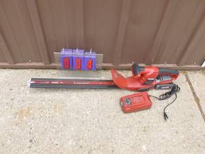Craftsman 24 volt cordless hedge trimmer with battery & charger. Nearly new. Tested & works. As shown.