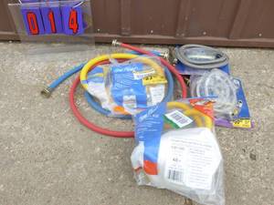 Box of new dishwasherclothes washer hoses & 2 flexible gas lines. As shown.